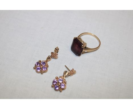 A 9ct gold dress ring set amethyst and a pair of 9ct gold earrings set amethyst (8.5g)