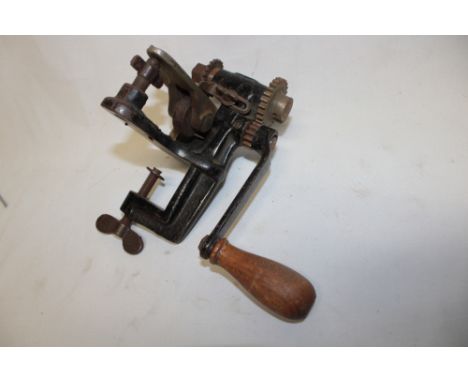 An unusual old bench mounted leather worker's pattern tool with rotating handle