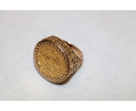 A 9ct gold signet ring mounted with an Edward VII 1909 gold sovereign (16.4g gross)