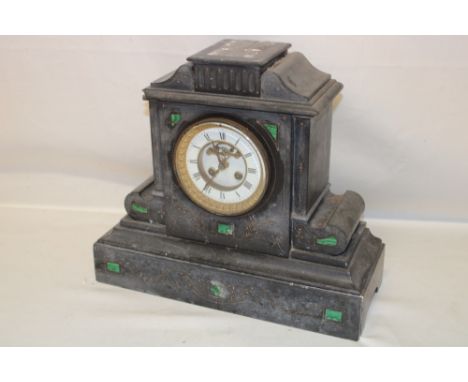 A 19th century mantel clock with part visible escapement in malachite and black slate case (af)