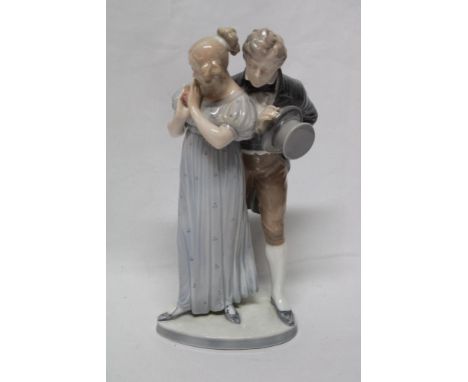 A Royal Copenhagen china figure of a Victorian male and female No. 1680, 11" high