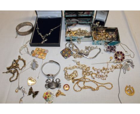 A quantity of various costume jewellery including silver oval bangle, silver necklace, various dress rings, earrings, necklac