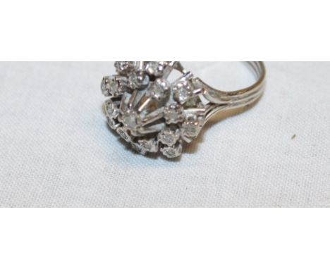 An 18ct white gold dress ring set diamond chips (6.2g)