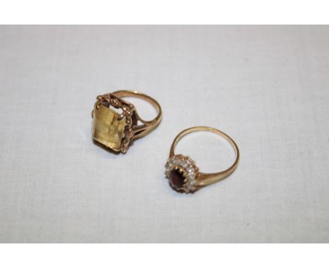 A 9ct gold dress ring set smoky quartz and one other 9ct gold dress ring set garnet and cubic zirconia (6.5g)(2)