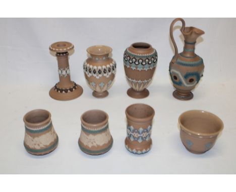 A selection of Doulton silicon pottery including tapered ewer, two similar tapered vases, candlestick and other pieces