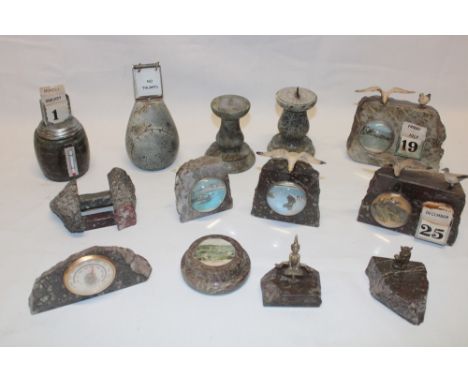 A selection of Cornish serpentine ornaments including desk calendars, miniature sundial, paperweights etc.