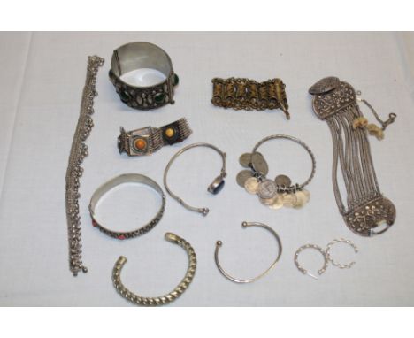 A selection of various silver costume jewellery, coin mounted bangle, eastern jewellery etc