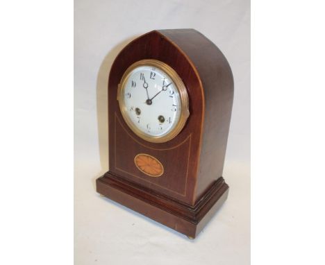 An Edwardian mantel clock with enamelled circular dial in inlaid mahogany gothic arched case