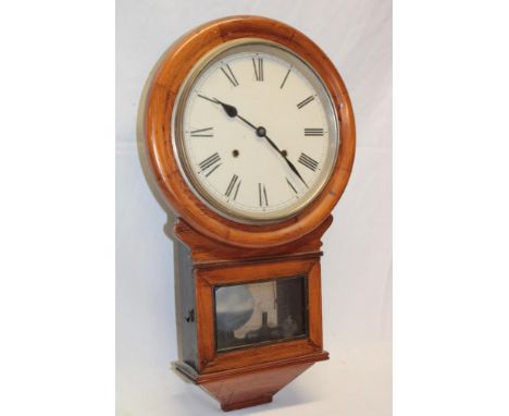 An old wall clock with painted circular dial in polished walnut drop-dial case