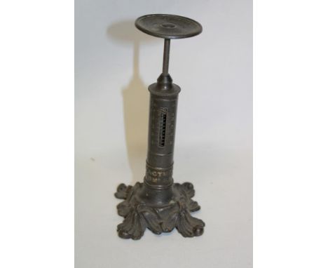 An old brass spring-action postal scales by E. Ratcliffe