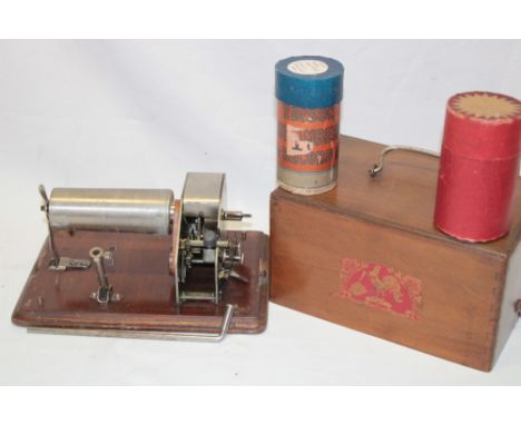An unusual French clockwork portable phonograph with cockerel trade mark in walnut case with cylinders