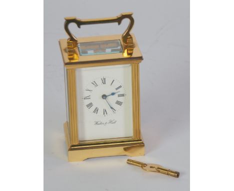WALKER AND HALL, TWENTIETH CENTURY GILT BRASS CARRIAGE CLOCK, of typical form with reeded corners and top carrying handle to 