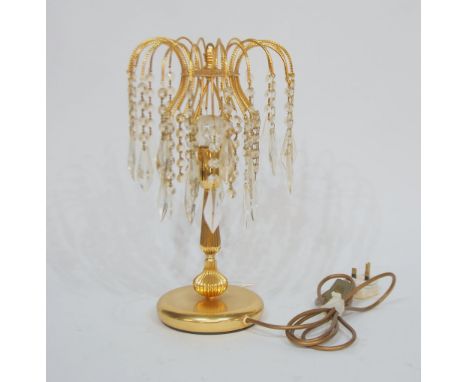 MODERN GILT METAL TABLE LAMP, hung with two tiers of simulated glass prism moulded drops, on a reeded column and circular bas