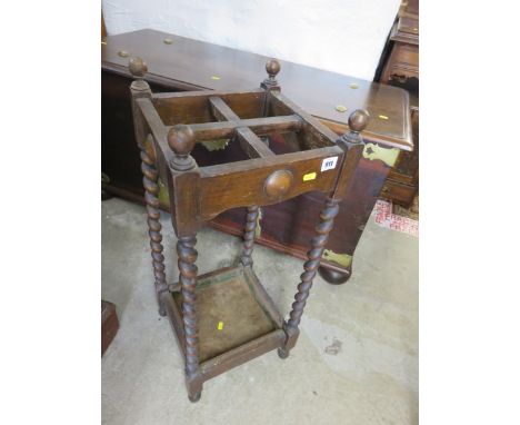 UMBRELLA STAND, an oak barley twist frame, 4 section stick stand
