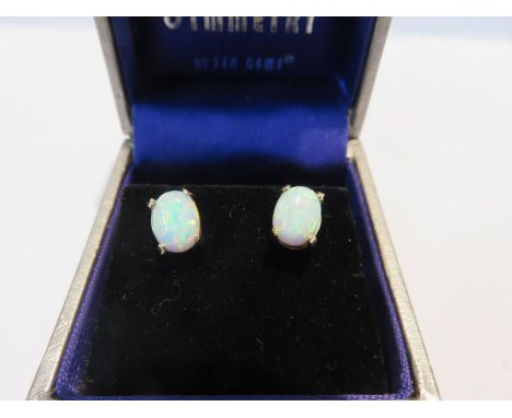 OPAL STUDS, pair of oval opal stud earrings in 9ct yellow gold 