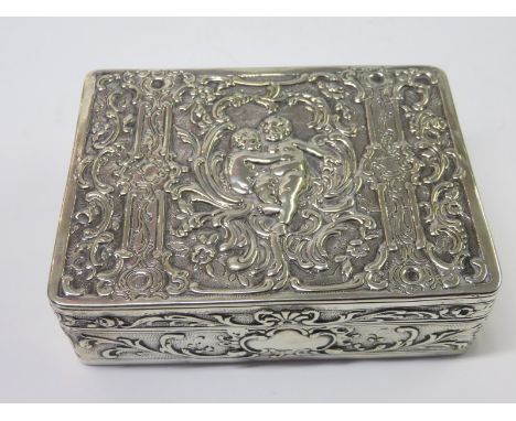 CONTINENTAL SILVER SNUFF BOX, an ornate embossed "Putti" design rectangular design snuff box
