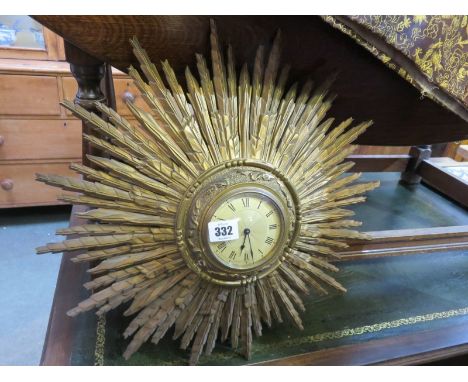 STAR BURST CLOCK, gilt wood star burst clock with Roman numerals, the Swiss movement stamped Buren
