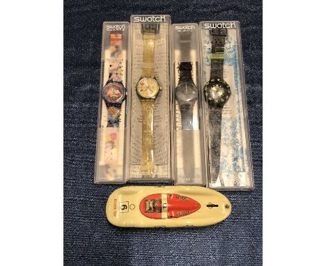 An early tin plate racing car Biller-Toy, made in U.S Zone Germany and four Swatch watches in cases including karma sutra, mu