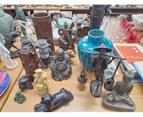 A collection of Buddhist carved wooden and other bronze metal and brass ornaments, a Royal Doulton plate, bookends etc.