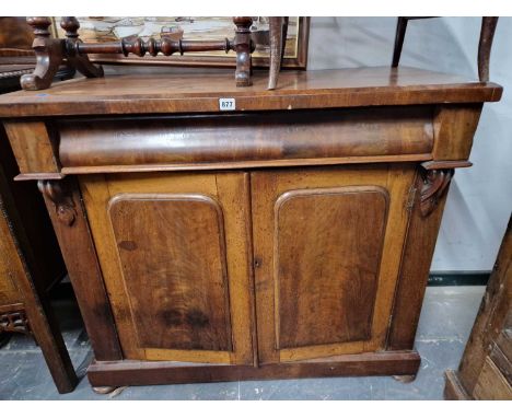 A Victoarian mahogany chiffonier with blind frieze drawer ove two panel doors.