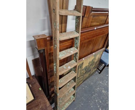 A rustic decorative scullery ladder.