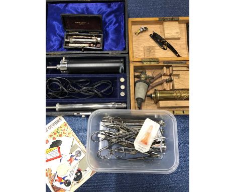 Vintage medical items to include fleams, A Maw & Co. medical pump, clamps etc. together with a small selection of Golly adver