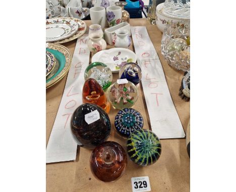 A group of eight paperweights and various pieces of Radford pottery.