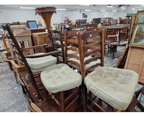 A set of seven 19th-century ladder back dining chairs including one carver