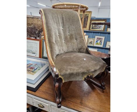 A Victorian button back rocking chair.