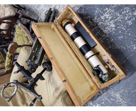 A pine cased 4 inch astronomical telescope with its tripod