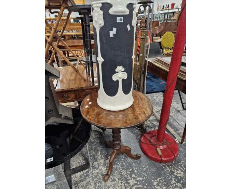 A Bretby pottery stick stand together with a mahogany tripod table