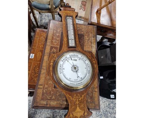 A banjo aneroid barometer in a marquetry rosewood case