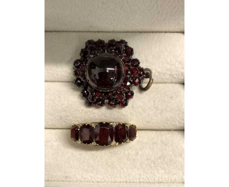 A Bohemian garnet pendant and a unhallmarked gold and garnet ring with old cut diamonds assessed as 15ct gold. 15ct weight 4.