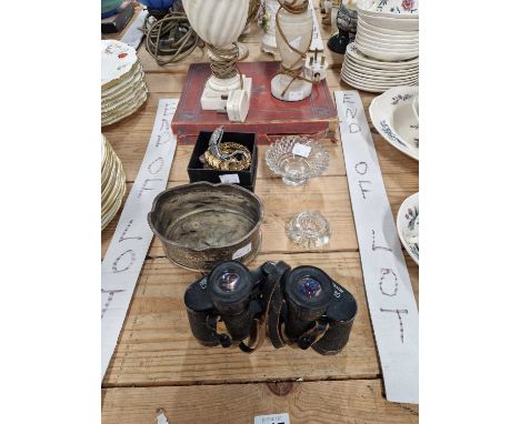 A pair of Carl Zeiss binoculars, a cyma wristwatch, a costume bracelet,and an alabaster lamp.