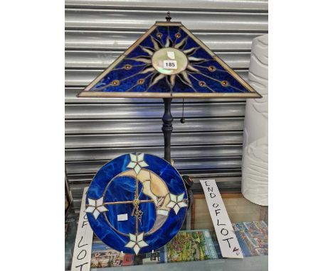 A blue ground leaded glass shade to a table lamp together a similar faced battery driven clock