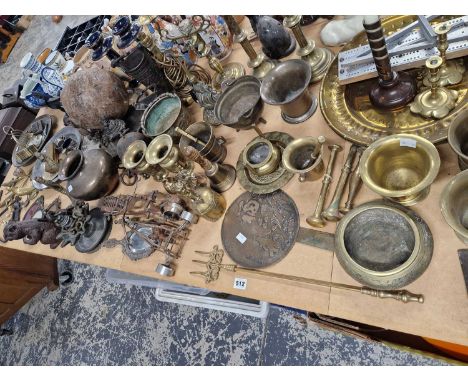 An interesting metalware selection includes an eastern fan, pestle and mortar, squirrel nut cracker, seahorse stands, brass c