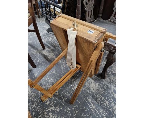 An artist fold away easel stand.