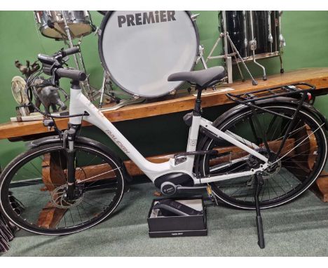 A Raleigh electric battery assist bicycle in nearly new condition, complete with charger and accessories.