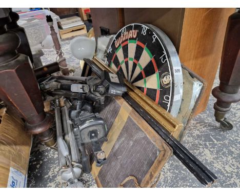 A Winmau dart board, a deco mirror, two other mirrors, a small two fold screen and three camera tripod strands. 
