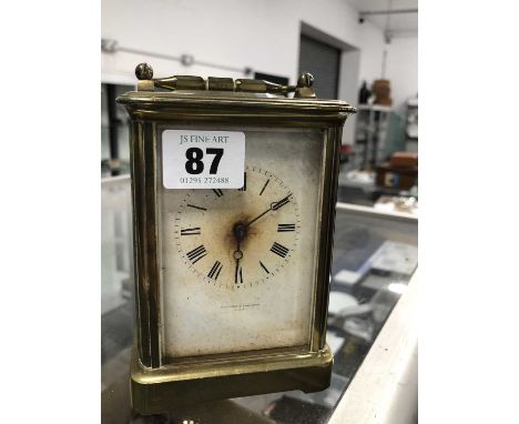 A brass carriage clock.