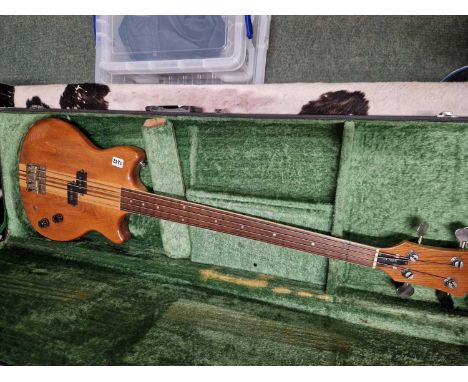 A fretless bass guitar by Samick in a fitted case. ( a/f)