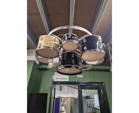 An unusual drum kit hanging light fitting. 