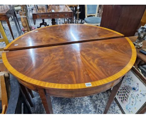 A pair of mahogany demi loom hall tables. 