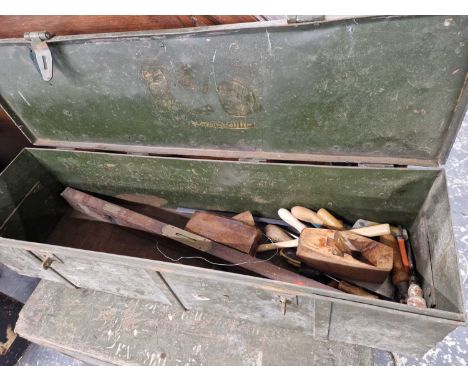 A vintage military steel tool box and contents