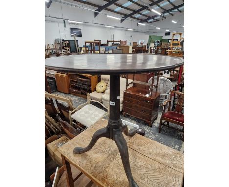 An 18th-century mahogany tilt top tripod table.