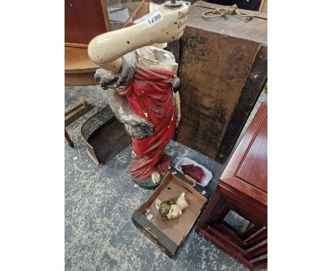 A large plaster statue, formerly a light fitting complete with rouge flame form shade 