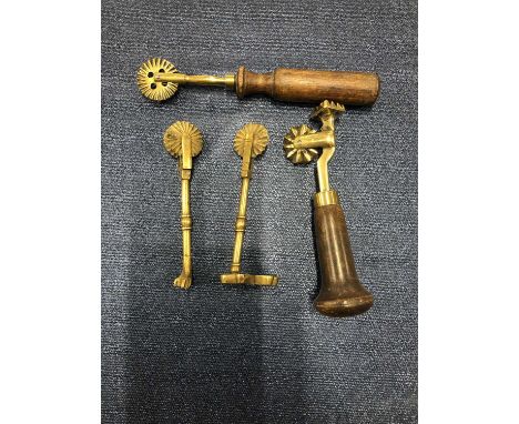 Four antique pastry makers tools. 