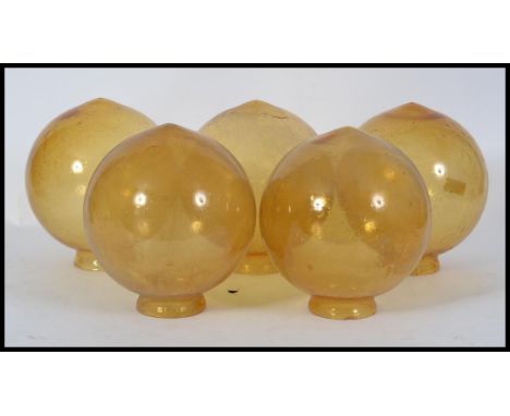 A collection of vintage yellow glass globes - shades being 5 in total ( see illustrations )