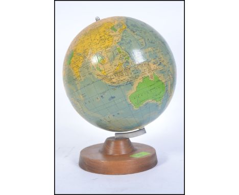 A retro 1985 political desk top globe being raised on a wooden plinth base. Measures H27 x W22 x D22 (cm)