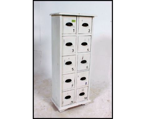 A vintage industrial style ten drawer index filing cabinet, having cup handles  and each drawer numbered one to ten. H112xW41